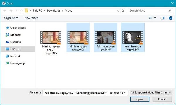 Nhấn giữ vào phím Ctrl, rồi tiếp đến chọn vào các video mà mình muốn ghép và nhấn Open
