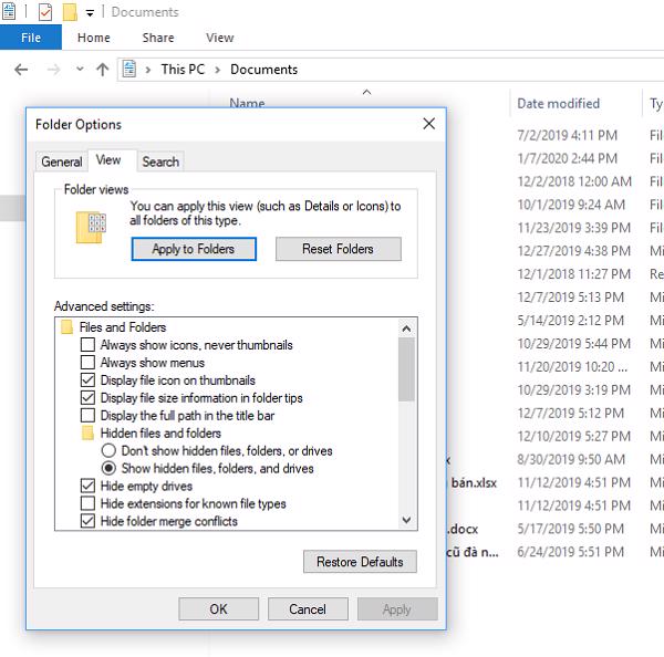 Trên cửa sổ Folder options chọn vào tab View